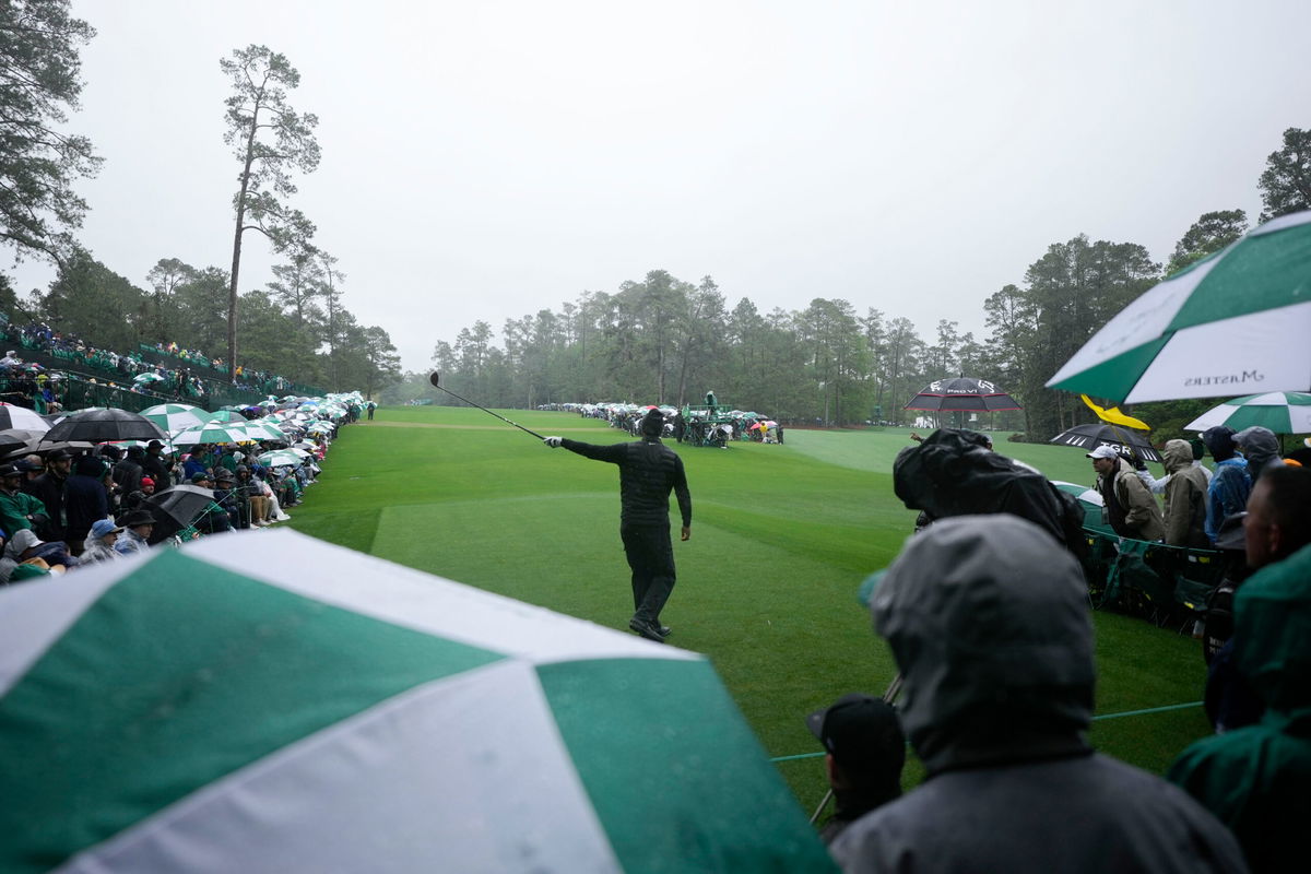 <i>Matt Slocum/AP</i><br/>Woods points in the direction of his tee shot on the 14th hole during the third round.