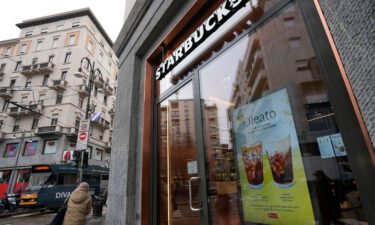 A Starbucks sign advertises the company's Oleato coffee in one of their coffee shops in Milan