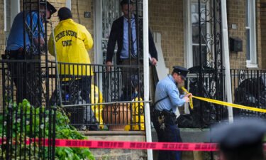 Investigators work the scene of a quadruple shooting Friday in Philadelphia.
