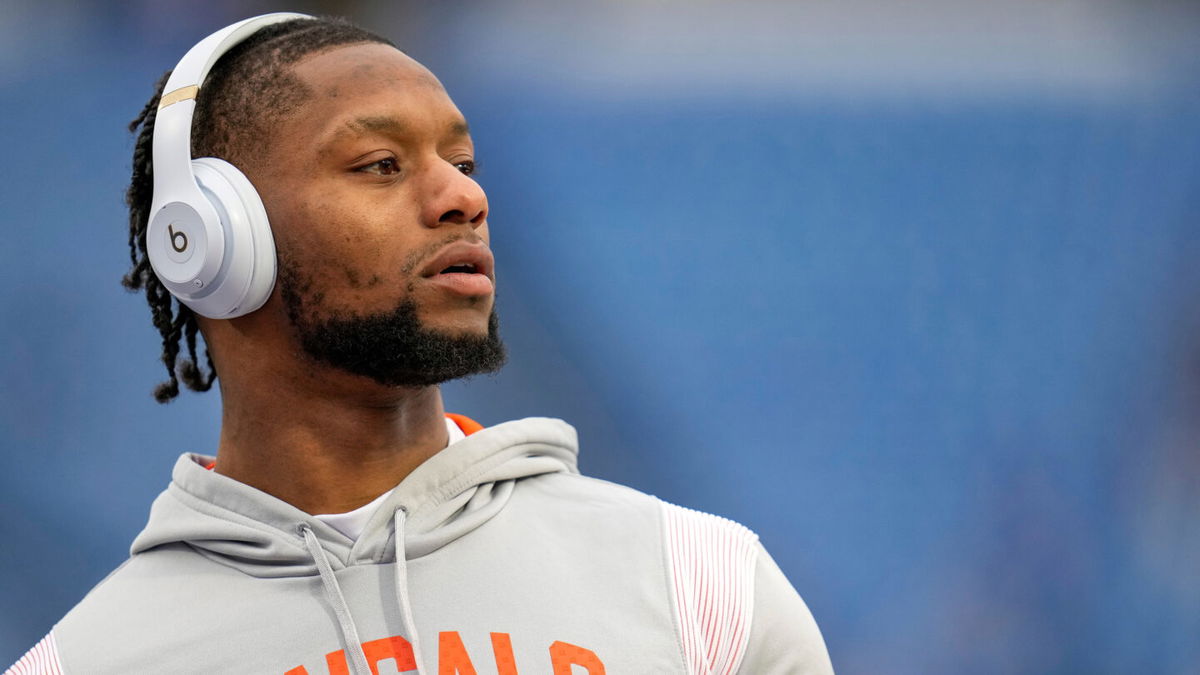 <i>Sam Greene/The Enquirer/USA Today Network</i><br/>Cincinnati Bengals running back Joe Mixon throws passes with fans during warmups before the NFL divisional playoff game between the Bengals and the Buffalo Bills on January 22 at Highmark Stadium in Orchard Park