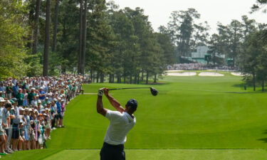 Woods tees off during the first round.