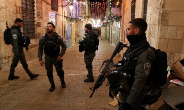 Israeli police stand guard following the fatal shooting of a Palestinian man near the Al-Aqsa compound