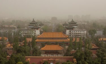 A sandstorm darkens the sky over the Chinese capital Beijing on April 11.