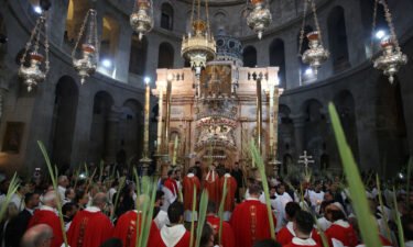 Palm Sunday during the pandemic will be different than this 2017 procession at the Church of the Holy Sepulchre in Jerusalem's Old City.