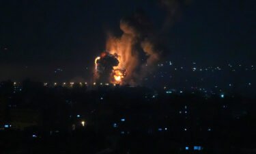 Smoke and fire rises from an explosion caused by an Israeli airstrike on Gaza City early Friday.
