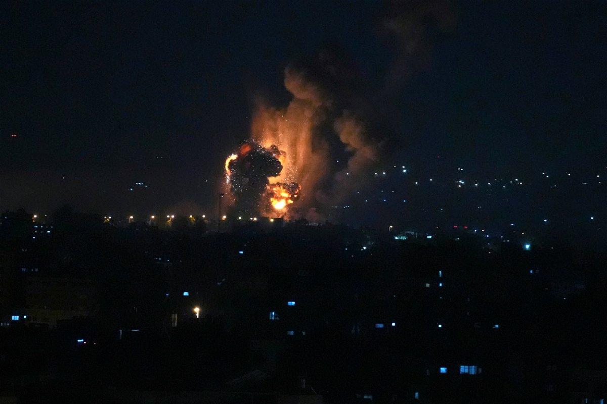 <i>Adel Hana/AP</i><br/>Smoke and fire rises from an explosion caused by an Israeli airstrike on Gaza City early Friday.