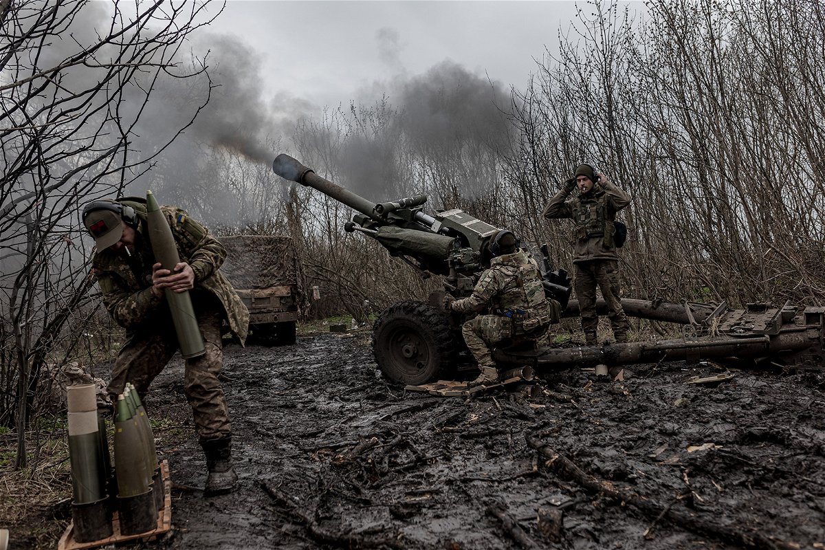 <i>Diego Herrera Carcedo/Anadolu Agency/Getty Images</i><br/>Ukrainian soldiers of the Da Vinci Wolves Battalion fire artillery in the direction of Bakhmut on April 3