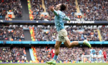 Jack Grealish of Manchester City celebrates after scoring the team's fourth goal during the Premier League match between Manchester City and Liverpool FC at Etihad Stadium on April 1 in Manchester