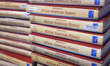 Books are piled up in the classroom for students taking AP African-American Studies at Overland High School on November 1