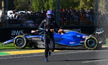 Alexander Albon walks from his car after a crash that led to a red flag.