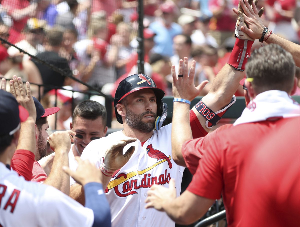 St. Louis Cardinals' Paul Goldschmidt celebrates in the dugout after hitting a solo home run in the first inning of a baseball game against the Detroit Tigers, Sunday, May 7, 2023, in St. Louis.