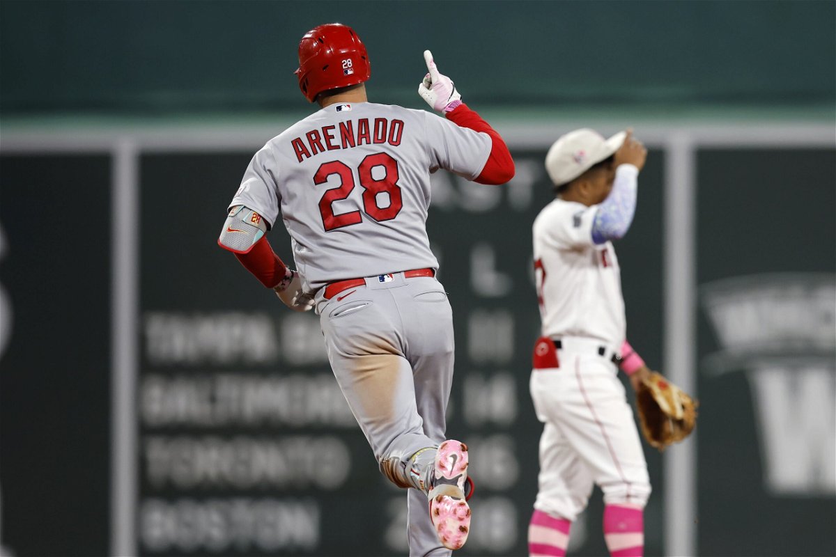 St. Louis Cardinals' Nolan Arenado (28) rounds the bases on his two-run home run past Boston Red Sox's Enmanuel Valdez, right, during the eighth inning of a baseball game, Sunday, May 14, 2023, in Boston.
