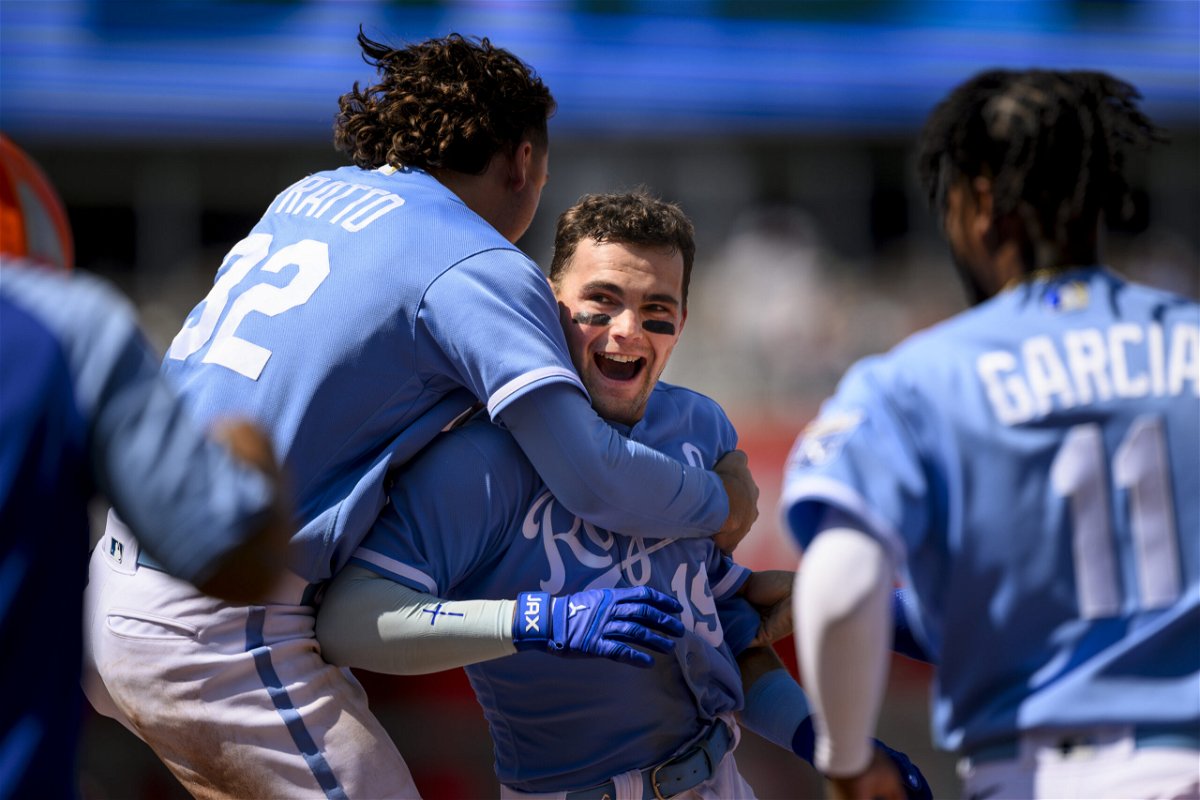 Kansas City Royals' Michael Massey, center, is mobbed by teammates, including Nick Pratto (32), after hitting a one-RBI single to win a baseball game against the Washington Nationals during the ninth inning Sunday, May 28, 2023, in Kansas City, Mo.