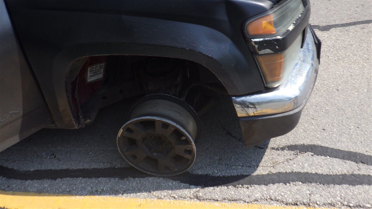 The wheel of a vehicle that ran over three spike strips during a Cole County police chase Thursday, May 25, 2023.