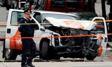 A damaged Home Depot truck remains on the scene after the driver mowed down people on a riverfront bike path near the World Trade Center in New York.