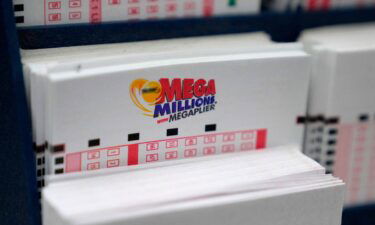 A display holds Mega Million lottery ticket wagering cards at Ted's State Line Mobil station on January 5 in Methuen