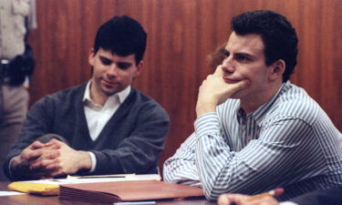 Erik Menendez (R) and his brother Lyle listen to court proceedings on May 17