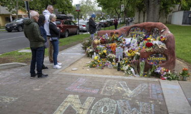 People view a memorial set up in Davis
