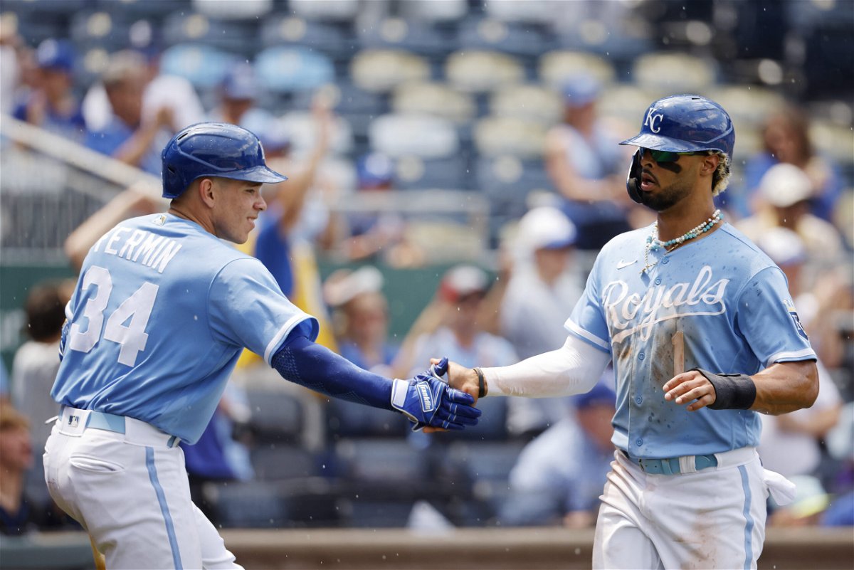 Kansas City Royals' Freddy Fermin (34) congratulates MJ Melendez (1) after Melendez scored from second base off a Michael Massey single during the fifth inning of a baseball game against the Colorado Rockies in Kansas City, Mo., Sunday, June 4, 2023. 
