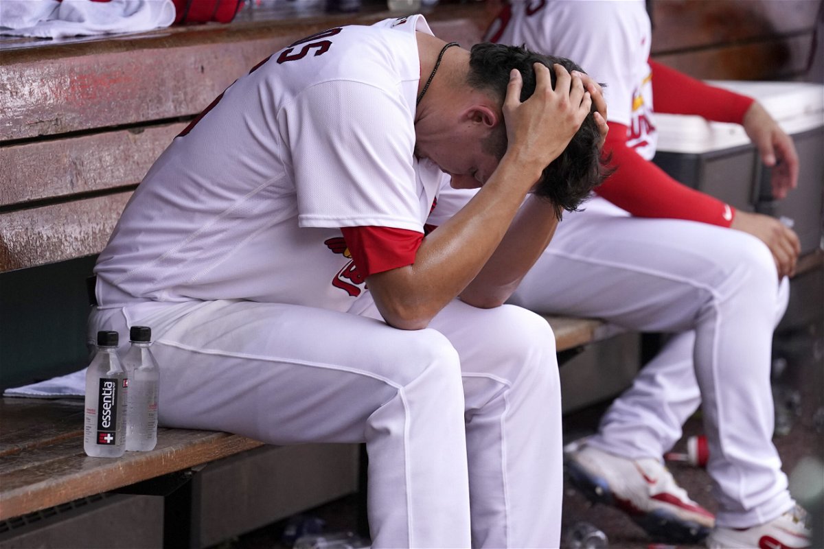 St. Louis Cardinals relief pitcher Giovanny Gallegos sits in the dugout after giving up a two-run home run to San Francisco Giants' Mike Yastrzemski during the ninth inning of a baseball game Wednesday, June 14, 2023, in St. Louis.