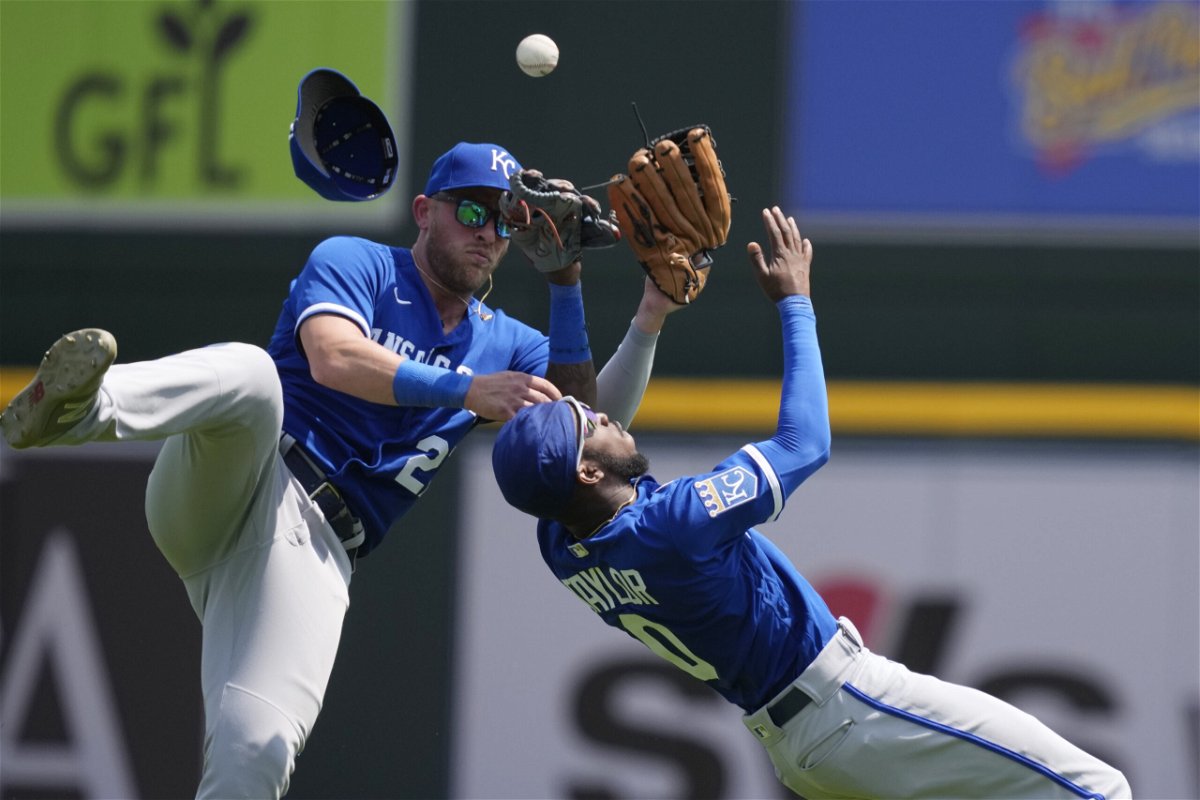 Kansas City Royals left fielder Samad Taylor (0) and right fielder Matt Beaty collide as they chase the tripe hit by Detroit Tigers' Spencer Torkelson during the eighth inning of a baseball game, Wednesday, June 21, 2023, in Detroit.