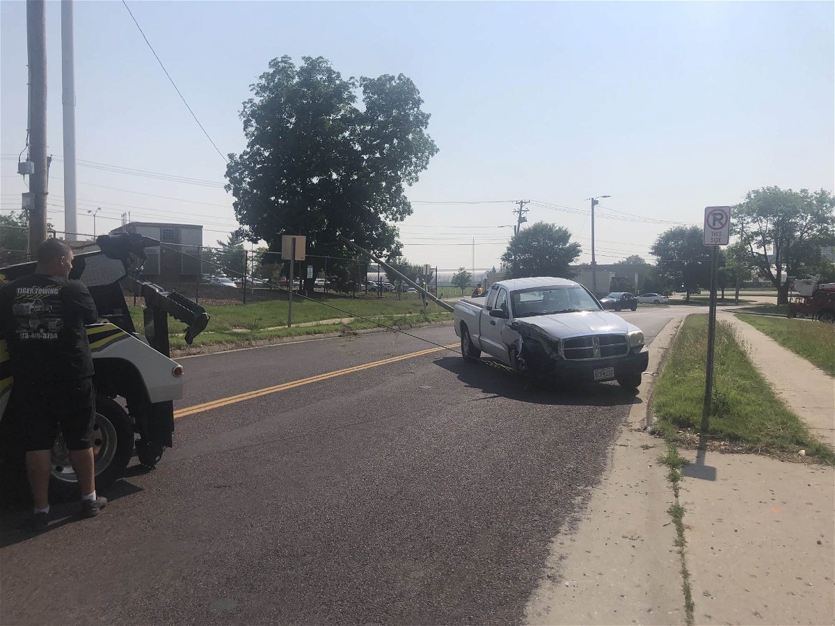 A white truck is damaged after crashing into a utility pole near Ashland Road and College Avenue on Monday, June 5, 2023.