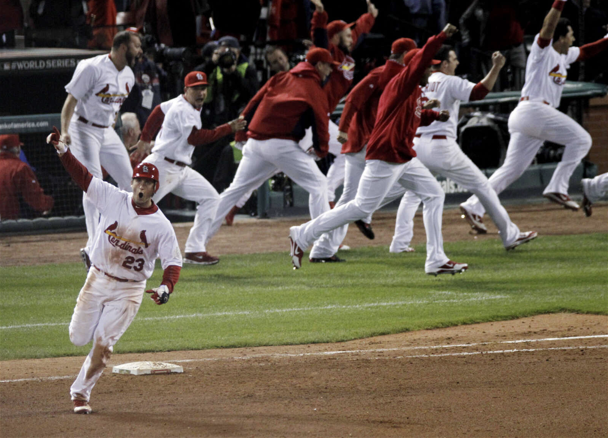 St. Louis Cardinals' David Freese reacts after hitting a solo home run off a pitch by Texas Rangers' Mark Lowe in the 11th inning of Game 6 of baseball's World Series Thursday, Oct. 27, 2011, in St. Louis. The Cardinals won 10-9. 