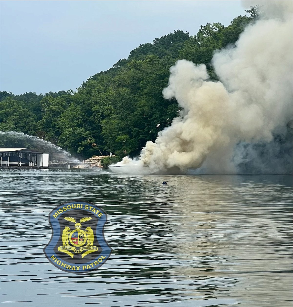 A boat smolders after an explosion at the Lake of the Ozarks on Thursday, June 8, 2023. The Missouri State Highway Patrol said the explosion hurt two people.