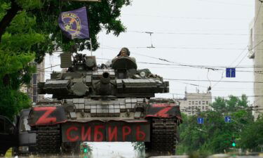 Members of Wagner group sit atop of a tank in a street in the city of Rostov-on-Don on June 24.