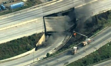 Firefighters respond to the scene of a collapse of Interstate 95