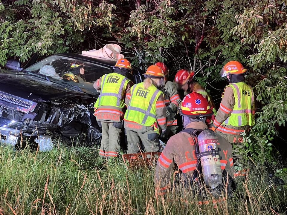 Boone County firefighters at the scene of a crash that closed Route B early Monday, June 12, 2023.