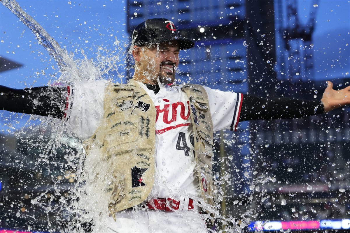 Minnesota Twins starting pitcher Pablo Lopez is doused with water after pitching a complete-game shutout to defeat the Kansas City Royals 5-0 of a baseball game Wednesday, July 5, 2023, in Minneapolis. (AP Photo/Abbie Parr)