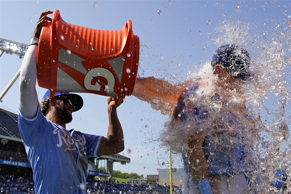 Kansas City Royals' Bobby Witt Jr., right, gets doused by MJ Melendez after their baseball game against the Tampa Bay Rays Sunday, July 16, 2023, in Kansas City, Mo. The Royals won 8-4. (AP Photo/Charlie Riedel)