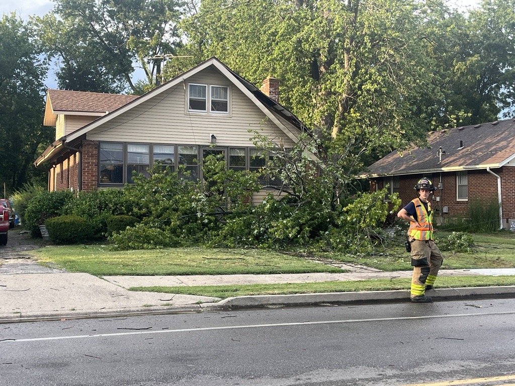 A tree is seen fallen in a yard near the corner of West Ash and North Greenwood streets in Columbia on Wednesday. A number of Boone and Callaway County residents are without power after storms came through Mid-Missouri on Wednesday evening.