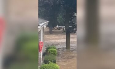 Gushing floodwater is seen in Highland Falls