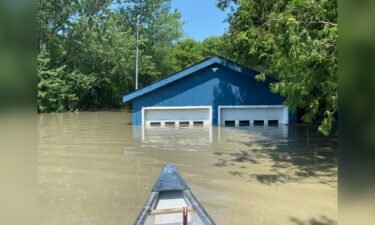 The flooded home was only accessible by boat at one point.