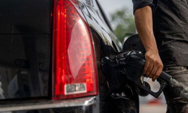 A person pumps gas at a Chevron gas station on May 26 in Austin