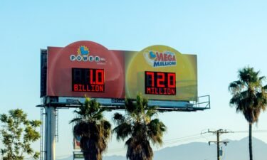 A freeway sign displays a 1 billion power ball jackpot and a 720 million Mega Million lottery jackpot in Los Angeles