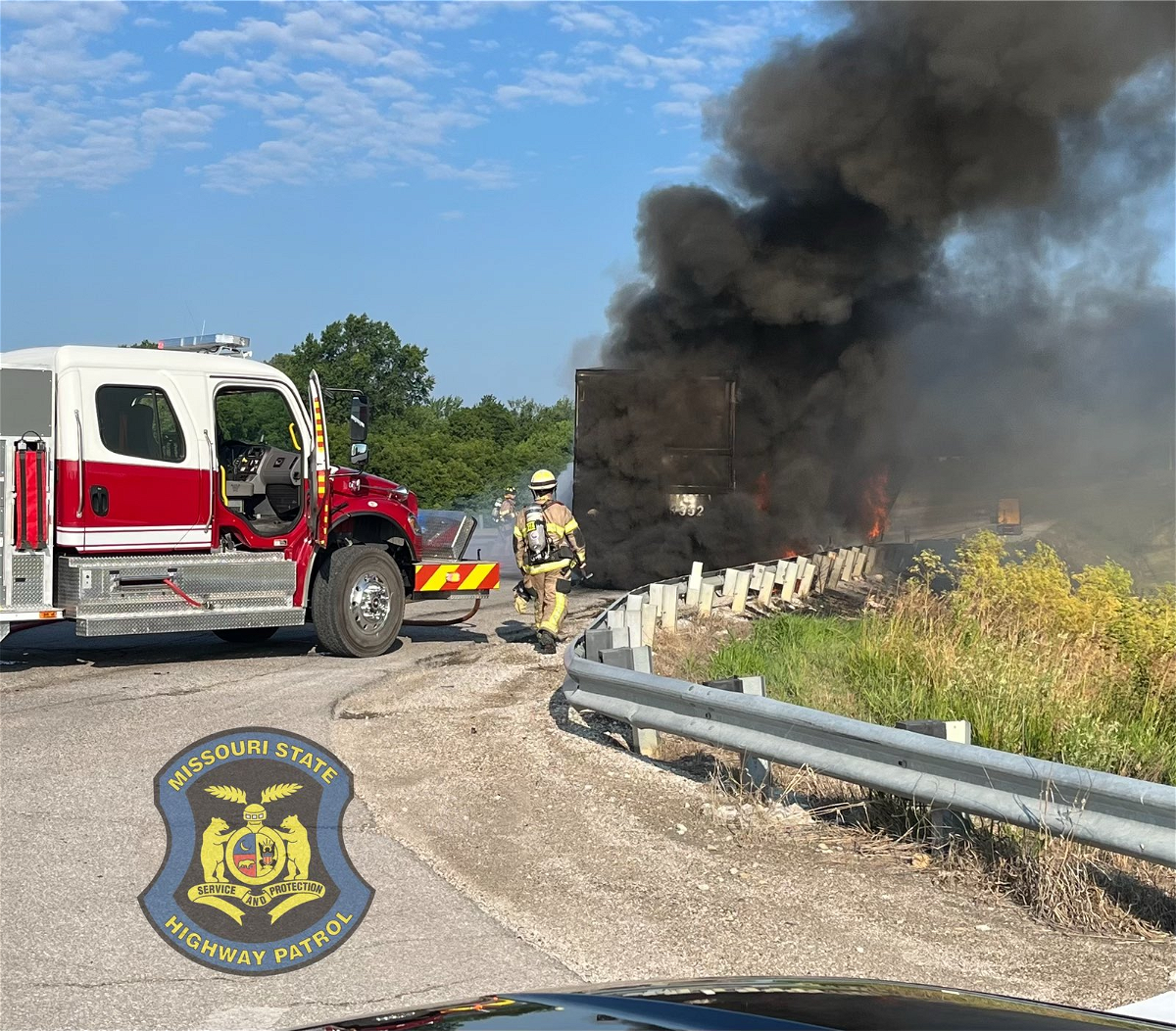 Firefighters work to put out fire near I-70 in Montgomery County on Tuesday, July 4, 2023.