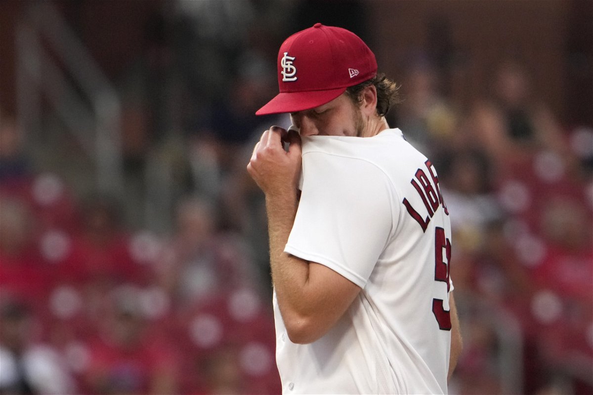 St. Louis Cardinals starting pitcher Matthew Liberatore wipes his face after giving up a two-run home run to Minnesota Twins' Ryan Jeffers during the second inning of a baseball game Thursday, Aug. 3, 2023, in St. Louis. (AP Photo/Jeff Roberson)