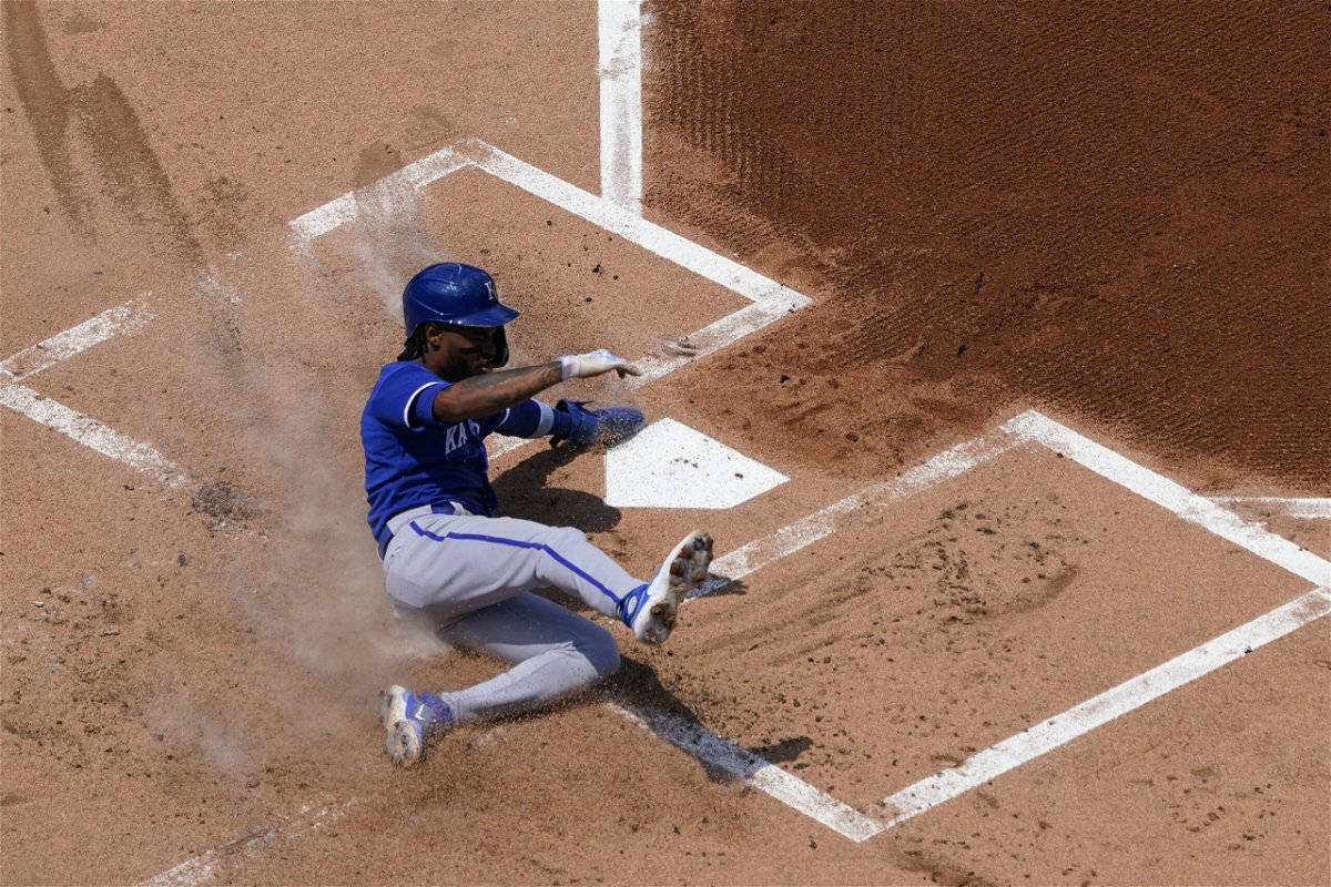 Kansas City Royals' Maikel Garcia scores on a single by Michael Massey during the first inning of a baseball game against the Philadelphia Phillies, Sunday, Aug. 6, 2023, in Philadelphia. 