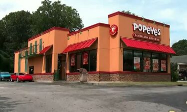 A woman is suing Popeyes following an alleged drive-thru assault at an Atlanta location.