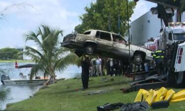 Miami-Dade police and Miami police divers are searching the murky waters of a lake in Doral were investigators believe as many as 30 cars are sunk on the bottom.