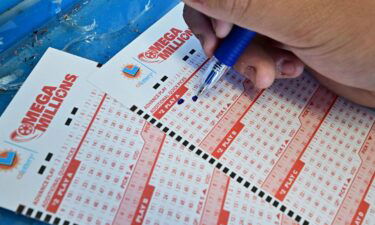 Numbers on tickets for the Mega Millions lottery are selected by a purchaser in Los Angeles