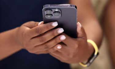 An attendee holds a new Apple iPhone 14 Pro during an Apple special event in Cupertino