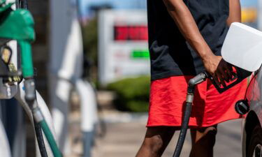 A person pumps gas at a Shell gas station on August 3 in Austin