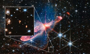 The question mark-shaped object could be the interaction of two galaxies