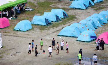 Staff for the UK booth of the 25th World Scout Jamboree prepare to leave the site in South Korea on August 5