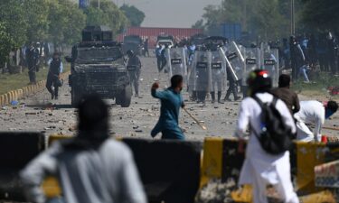 PTI supporters clash with police during a protest against the arrest of Imran Khan