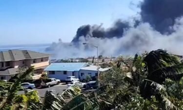 A screenshot from a video shows the fire burning in Lahaina